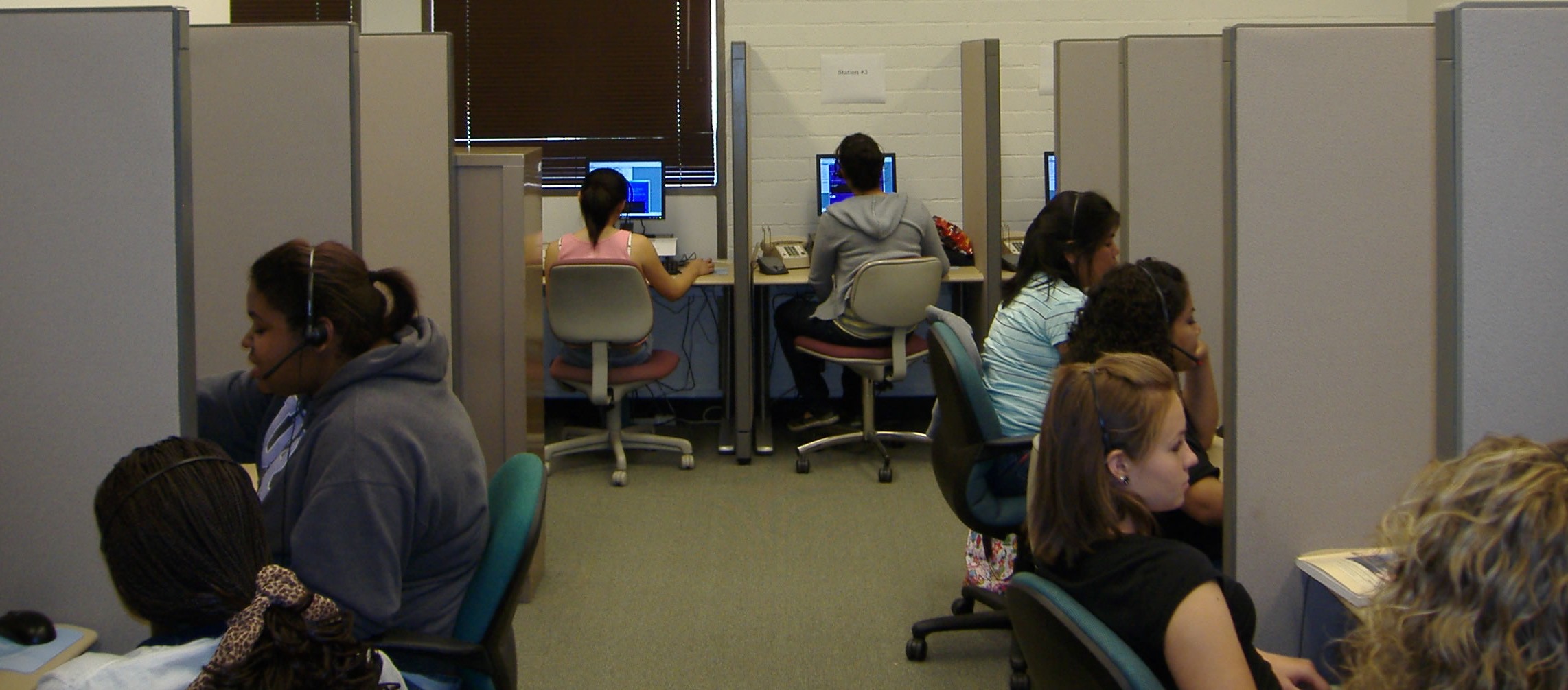 Interviewers work on a telephone survey in the 16-station CATI laboratory at the UCR SRC.